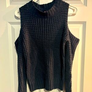 Shoulder showing sweater